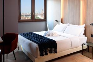 Postel nebo postele na pokoji v ubytování B&B Hotel Milano City Center Duomo