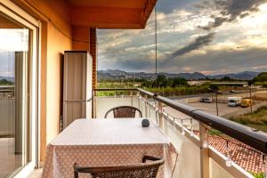 a balcony with a table and a view of a street at Vista Segária, Playa Deveses in Denia