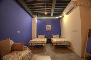 Letto o letti in una camera di 小島月光民宿 Moonlit Isle