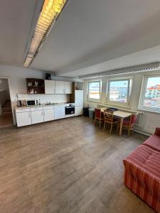 a living room with a couch and a table at Boardinghaus-net in Fulda