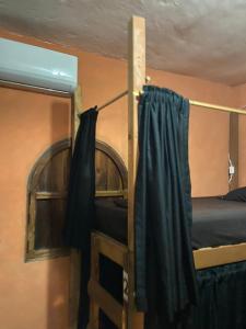 Postel nebo postele na pokoji v ubytování Maracuyá Hostal Zipolite