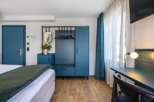 Letto o letti in una camera di Hotel Central am See