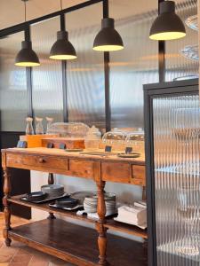 a table with plates and lights on top of it at Relais La Colombaia Spa & Wellness in Appignano