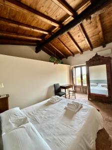 A bed or beds in a room at La Cantina Villa di campagna