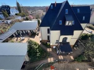 an aerial view of a house with a roof at Guest House Altes Forstamt in Eberswalde-Finow