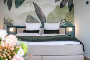 Letto o letti in una camera di Hotel Central am See