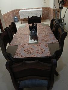 a wooden table with a table cloth on it at Casa de Descanso Zapatoca in Zapatoca +14 photos
