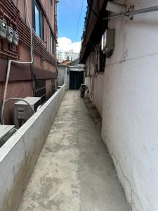 an empty alley in a building next to a building at Hanok House with a Yard 1 in Seoul
