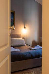 Postel nebo postele na pokoji v ubytování MARCONI ROOMs TORINO
