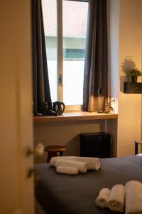 Postel nebo postele na pokoji v ubytování MARCONI ROOMs TORINO