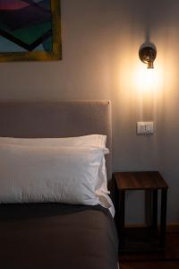 Postel nebo postele na pokoji v ubytování MARCONI ROOMs TORINO