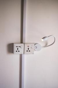 a close up of a white door with a door knob at Surfing Tusker - Thalpe in Talpe