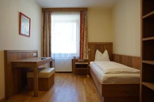 Postel nebo postele na pokoji v ubytování Gasthof-Fleischerei Engl