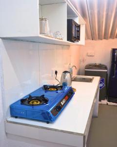 a blue stove top on a counter in a kitchen at Surfing Tusker - Thalpe in Talpe