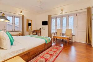Ένα ή περισσότερα κρεβάτια σε δωμάτιο στο Treebo Vitasta Villa, Srinagar