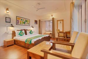 Ένα ή περισσότερα κρεβάτια σε δωμάτιο στο Treebo Vitasta Villa, Srinagar
