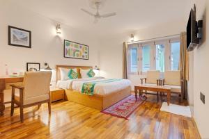 Ένα ή περισσότερα κρεβάτια σε δωμάτιο στο Treebo Vitasta Villa, Srinagar