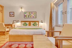 Ένα ή περισσότερα κρεβάτια σε δωμάτιο στο Treebo Vitasta Villa, Srinagar