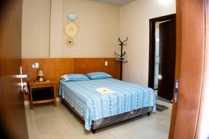 Postel nebo postele na pokoji v ubytování Hotel Karanda´y