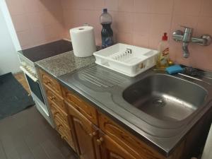 a kitchen counter with a sink and a sink at Djordje in Belgrade