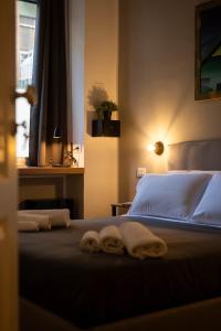 Postel nebo postele na pokoji v ubytování MARCONI ROOMs TORINO