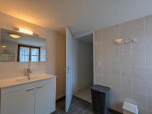 a bathroom with a sink and a mirror at Maison de plain-pied en Brenne avec cour close, Wifi et proche de Châteauroux et étang de pêche - FR-1-591-104 in Neuillay-les-Bois +17 photos