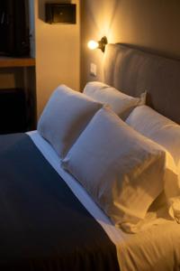 Postel nebo postele na pokoji v ubytování MARCONI ROOMs TORINO