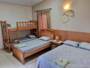 Postel nebo postele na pokoji v ubytování Hotel Karanda´y