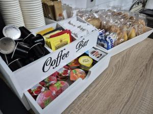 two white boxes filled with different types of food at B&B Borgo San Martino in Zagarolo