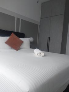 Postel nebo postele na pokoji v ubytování AGILE Luxury Suite at TRX Kuala Lampur