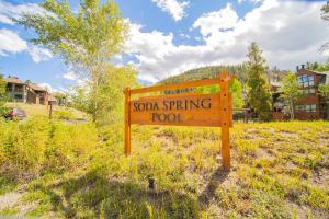 a sign that says soda spring tool in a field at Soda Spring 1910 by SummitCove Lodging in Keystone +76 photos