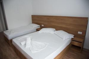 Postel nebo postele na pokoji v ubytování Hotel Besani