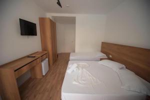 Postel nebo postele na pokoji v ubytování Hotel Besani