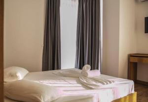 Postel nebo postele na pokoji v ubytování Hotel Besani