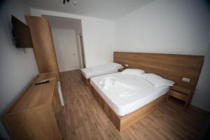 Postel nebo postele na pokoji v ubytování Hotel Besani