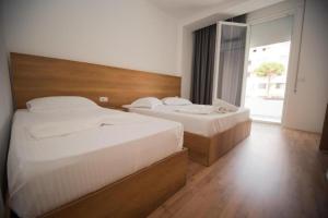 Postel nebo postele na pokoji v ubytování Hotel Besani