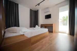 Postel nebo postele na pokoji v ubytování Hotel Besani