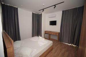 Postel nebo postele na pokoji v ubytování Hotel Besani