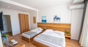 Postel nebo postele na pokoji v ubytování Hotel Besani