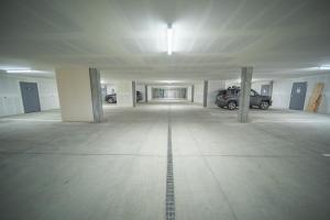 an empty parking garage with cars parked in it at Clearwater Lofts Bldg 3 103 by SummitCove Lodging in Keystone +55 photos