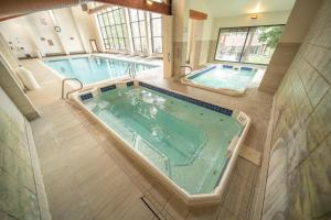 an overhead view of a large tub in a bathroom with two pools at Pines 2161 by SummitCove Lodging in Keystone +57 photos