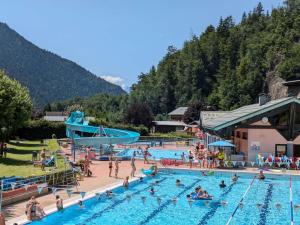 a group of people in a pool at a resort at Chalet rénové 12 pers, 5 ch, parking, poêle, sud-ouest - FR-1-342-321 in Beaufort