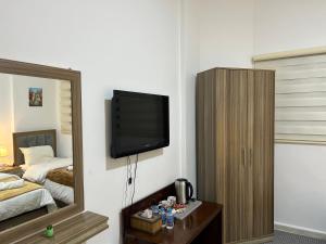 Postel nebo postele na pokoji v ubytování Petra Pass Hostel