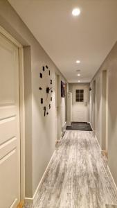 a hallway of a home with a clock on the wall at Rancho Apartment with King size bed in Sula