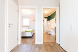 a room with a bed and a bathroom at Fehmarnstrand 78 App 12 in Staberdorf