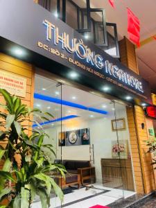 a thong restaurant with a sign on the front of it at Nhà nghỉ Thường Nga in Cat Ba