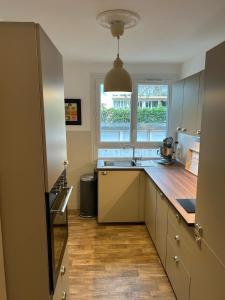 a kitchen with a sink and a counter top at New & Cozy in Lyon +9 photos