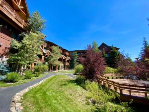 a winding road in front of some buildings at Tenderfoot Lodge 2620 by SummitCove Lodging in Keystone