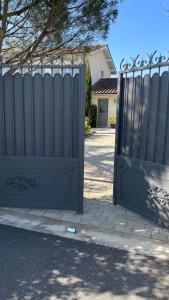 a pair of gates in front of a house at Suite 671 in Reyrieux