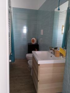 a bathroom with a tub and a toilet and a sink at Almarisa - appartamento vista mare in Salerno +61 photos